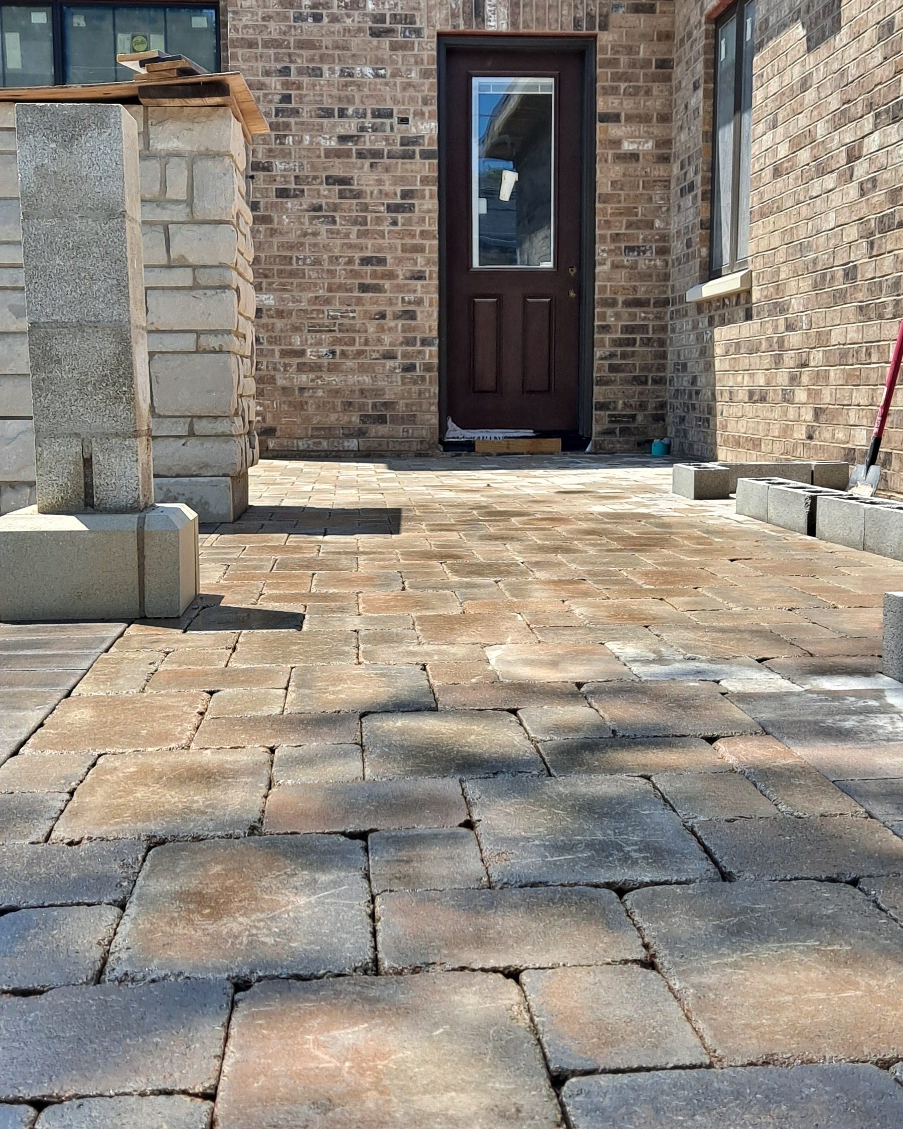 Paver patio with stone pillar
