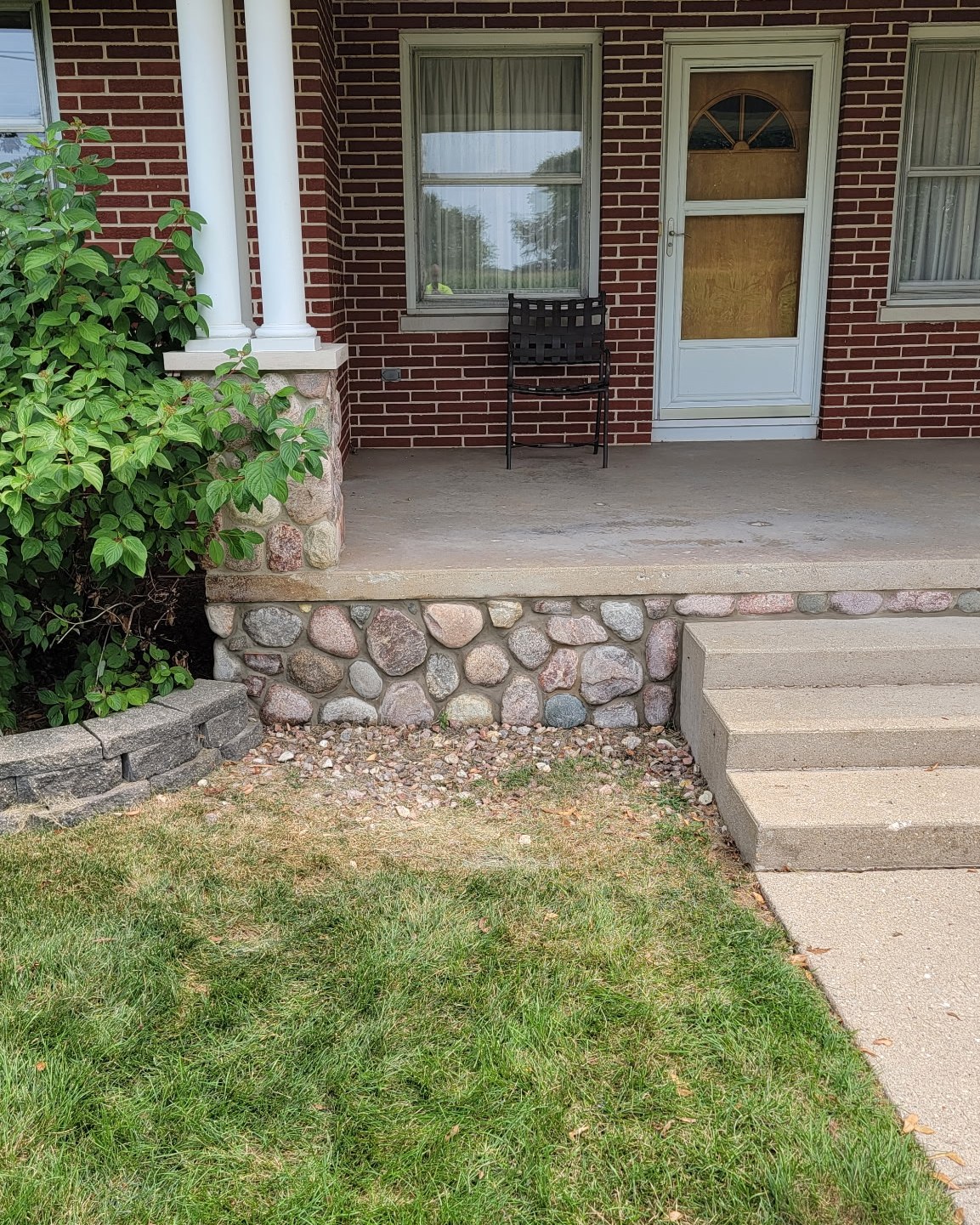 Brick and river-rock stone porch
